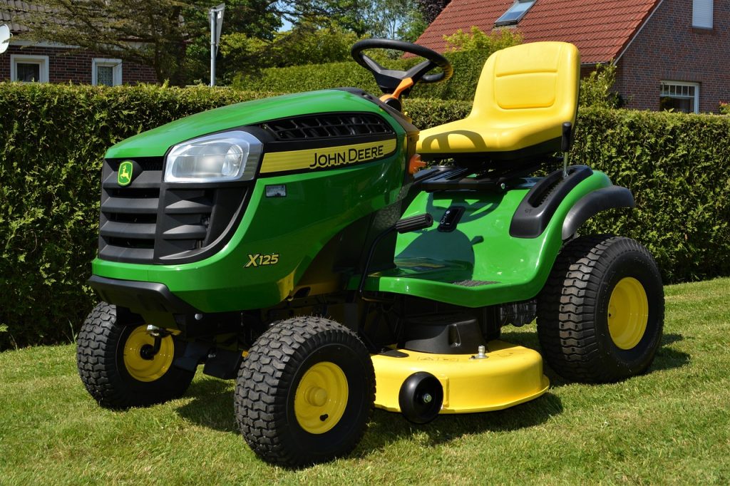 green and yellow gas riding mower